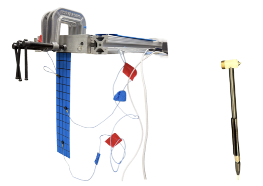 Hammer testing setup with accelerometers mounted on the wing